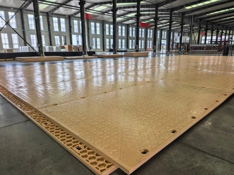 Cellular Core Heavy-Duty Ground Protection Mat forming a temporary access road for heavy equipment