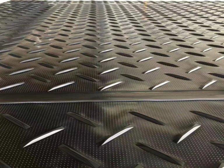 HDPE vs Rubber Ground Protection Mats: Load Spreading, Traction, and Best Uses